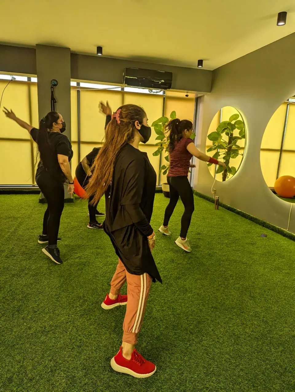 Women taking a group fitness class in the Fly Fitness third-floor studio